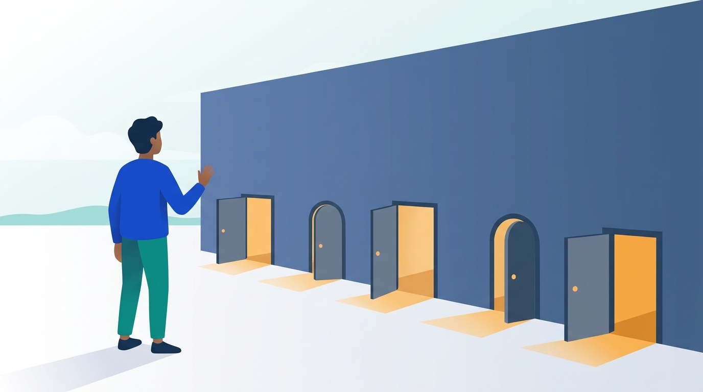 A person standing before a tall wall that has several small open doors with light coming through